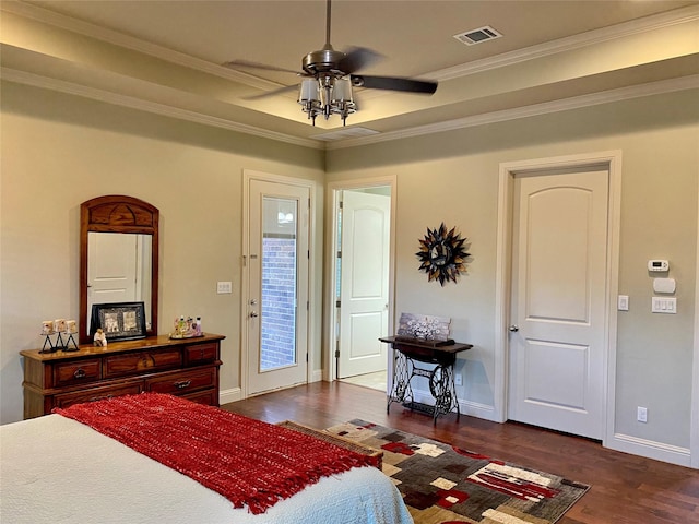 bedroom with ornamental molding and dark hardwood / wood-style flooring