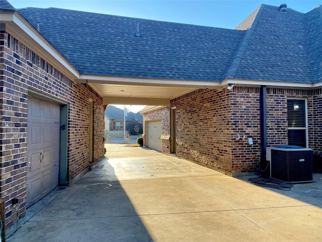 view of patio featuring a carport and central AC