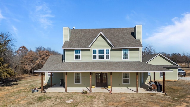 view of front of home with a patio area and french doors