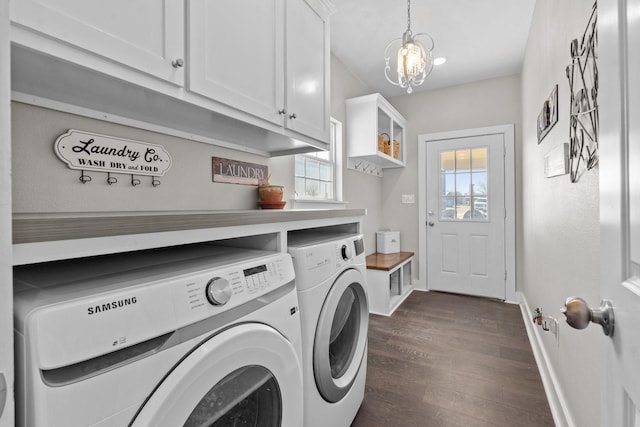 laundry area featuring an inviting chandelier, independent washer and dryer, dark wood-type flooring, baseboards, and cabinet space