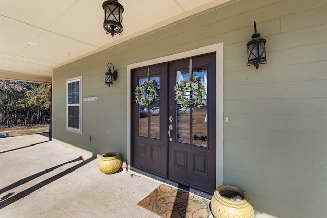 view of exterior entry featuring french doors