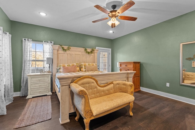 bedroom with ceiling fan and dark hardwood / wood-style floors