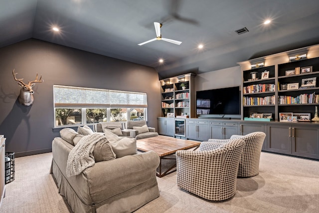 living room with bar, lofted ceiling, light carpet, and wine cooler