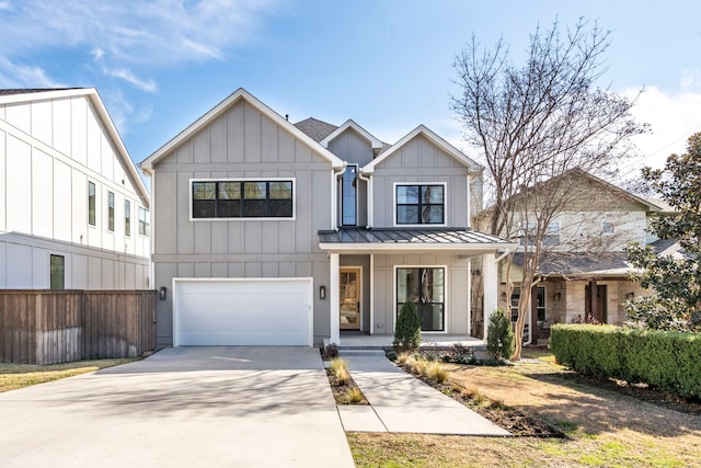 8010 Eagle Trl, Dallas, TX 75238 - modern farmhouse style home featuring a garage, a porch, a standing seam roof, driveway, and board and batten siding