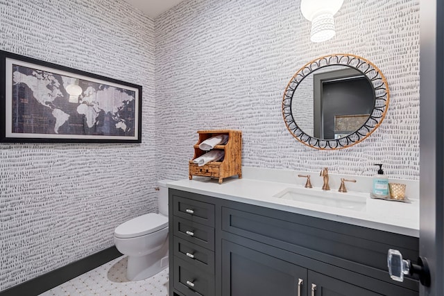 bathroom featuring vanity and toilet