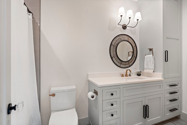 full bathroom with vanity and toilet