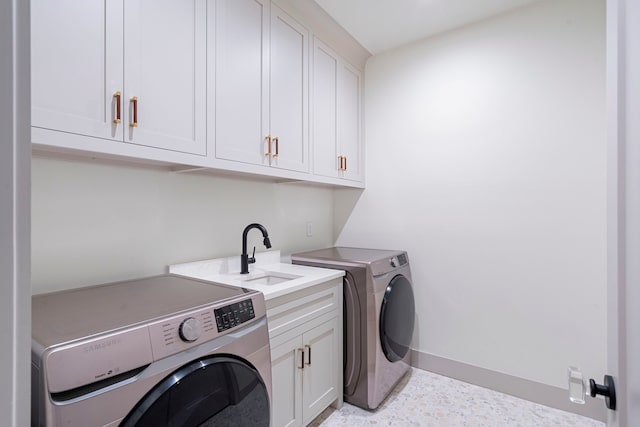 8010 Eagle Trl, Dallas, TX 75238 - laundry room with cabinet space, washing machine and dryer, and baseboards
