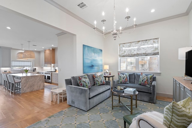 8010 Eagle Trl, Dallas, TX 75238 - living room with light wood finished floors, a chandelier, healthy amount of natural light, baseboards, and recessed lighting