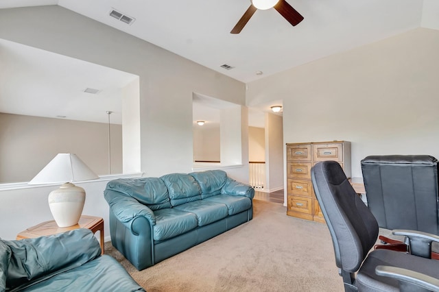 office area with ceiling fan, lofted ceiling, and light carpet