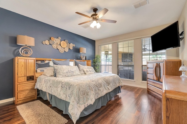 bedroom featuring ceiling fan and dark hardwood / wood-style floors