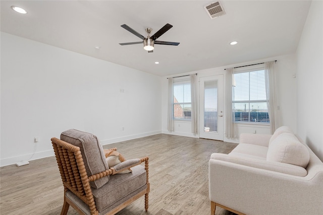 sitting room featuring recessed lighting, light wood-type flooring, visible vents, and baseboards