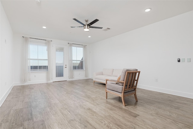 sitting room featuring recessed lighting, ceiling fan, light wood-style flooring, and baseboards