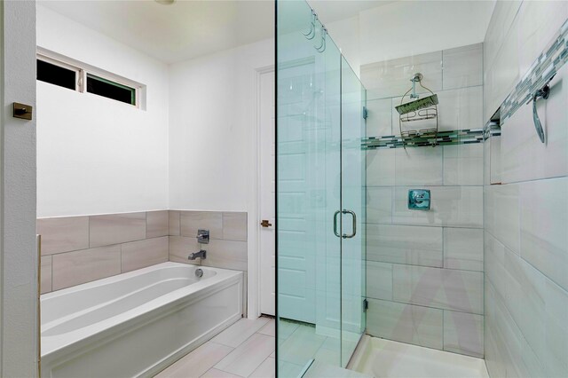 full bath with a shower stall and a bath