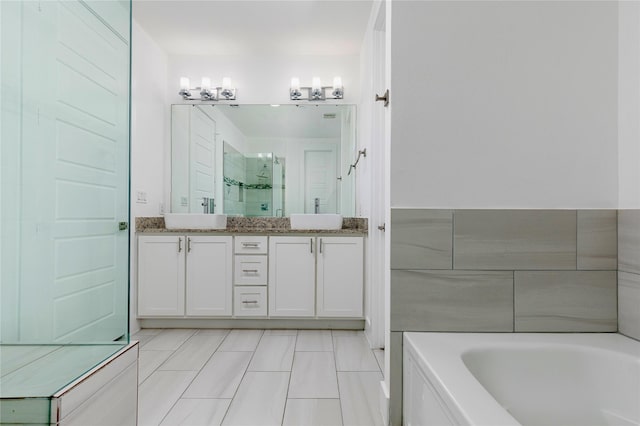 full bath featuring a stall shower, a garden tub, a sink, and double vanity