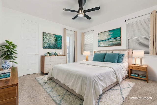 bedroom featuring light carpet and ceiling fan