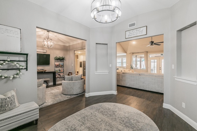 interior space featuring dark hardwood / wood-style floors and ceiling fan with notable chandelier