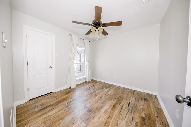 unfurnished bedroom featuring light hardwood / wood-style flooring and ceiling fan