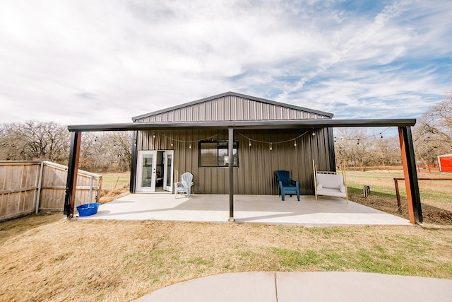 view of outbuilding featuring a lawn