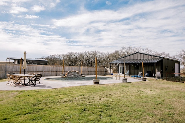 view of yard with a fenced in pool and a patio