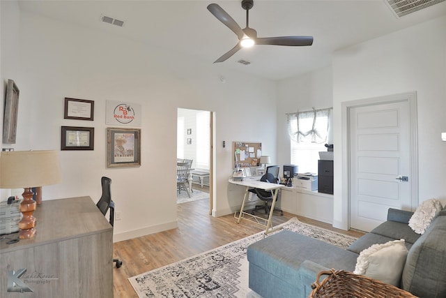 office with ceiling fan and light wood-type flooring