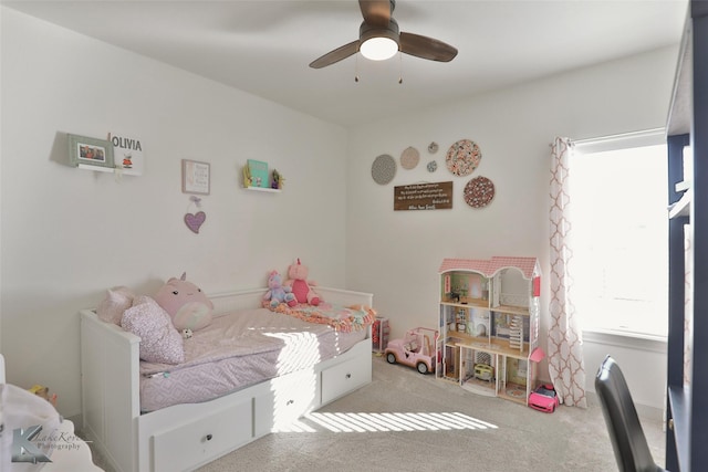 bedroom featuring light colored carpet and ceiling fan