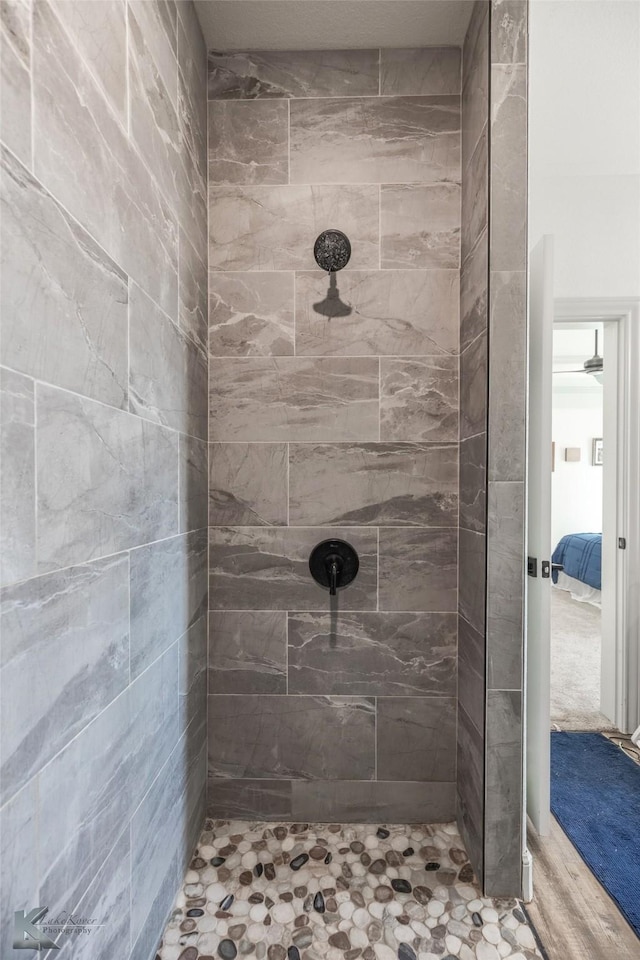 bathroom featuring tiled shower