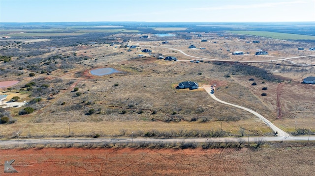 birds eye view of property featuring a rural view