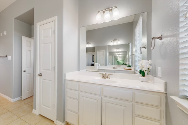 1240 Wedgewood Dr, Forney, TX 75126 - bathroom featuring tile patterned flooring, vanity, and baseboards
