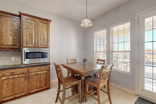 dining area featuring light tile patterned floors