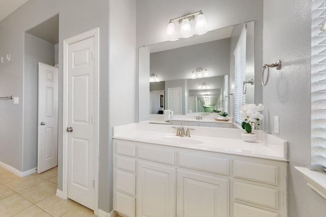 bathroom featuring tile patterned flooring and vanity