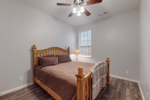 bedroom with dark wood-type flooring and ceiling fan