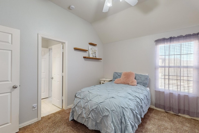 carpeted bedroom featuring ceiling fan, lofted ceiling, and multiple windows