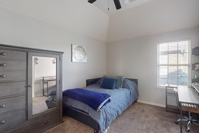 carpeted bedroom with vaulted ceiling and ceiling fan