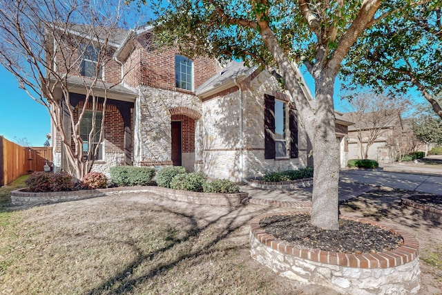 1240 Wedgewood Dr, Forney, TX 75126 - view of front of house featuring a porch, fence, and stone siding