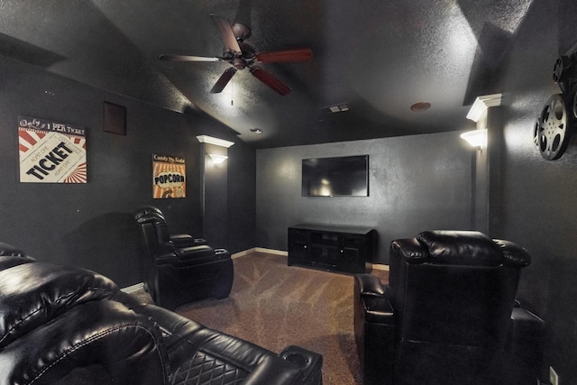 cinema with vaulted ceiling, carpet floors, a textured ceiling, and ceiling fan