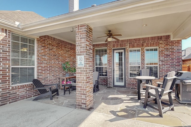 view of patio / terrace with grilling area and ceiling fan