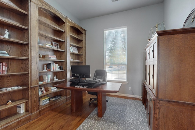 office area featuring dark wood-type flooring