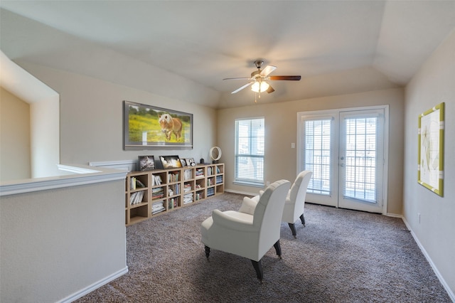 sitting room featuring baseboards, vaulted ceiling, carpet flooring, and french doors