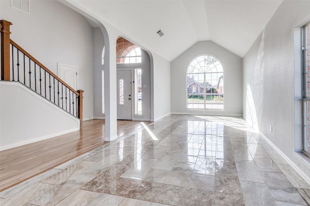 foyer entrance with high vaulted ceiling