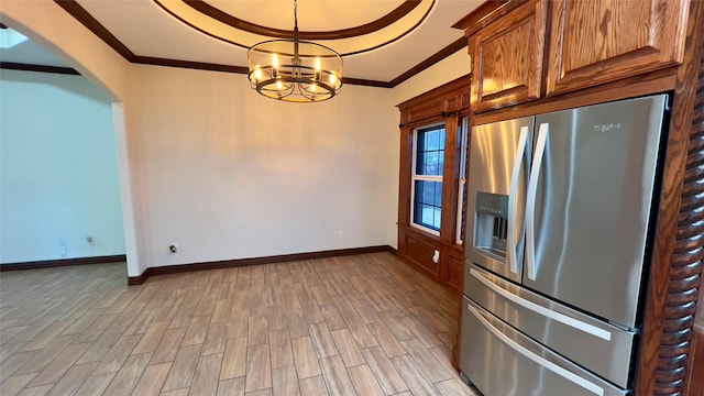 kitchen featuring hanging light fixtures, crown molding, a chandelier, and stainless steel refrigerator with ice dispenser