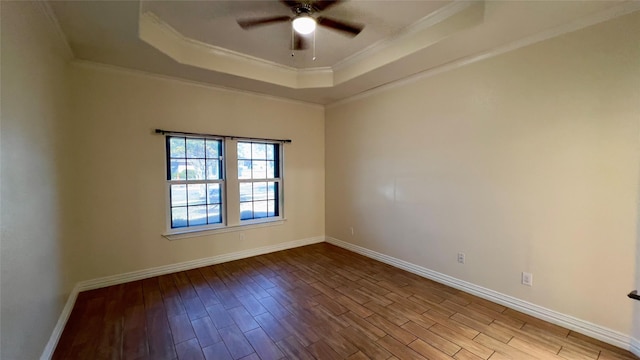 unfurnished room with crown molding, ceiling fan, a raised ceiling, and light hardwood / wood-style flooring