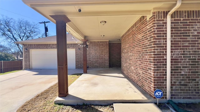 view of patio featuring a garage