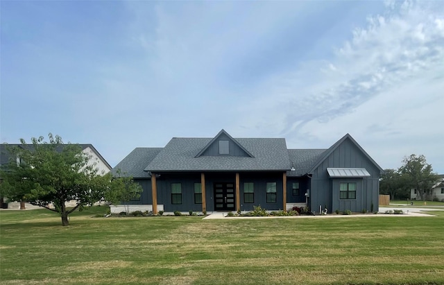 modern farmhouse with board and batten siding, roof with shingles, and a front lawn