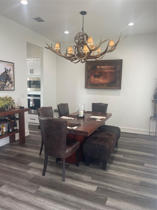 dining space with recessed lighting, visible vents, baseboards, and an inviting chandelier