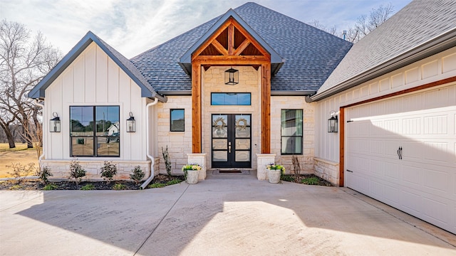 entrance to property with french doors and a garage