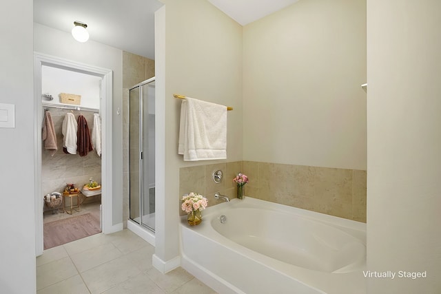 bathroom featuring shower with separate bathtub and tile patterned floors