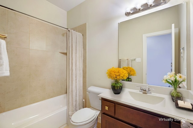 full bathroom with shower / bathtub combination with curtain, vanity, and toilet