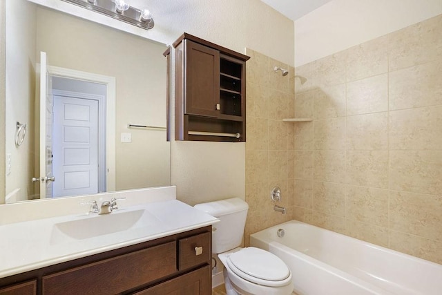 full bathroom featuring vanity, toilet, and tiled shower / bath combo