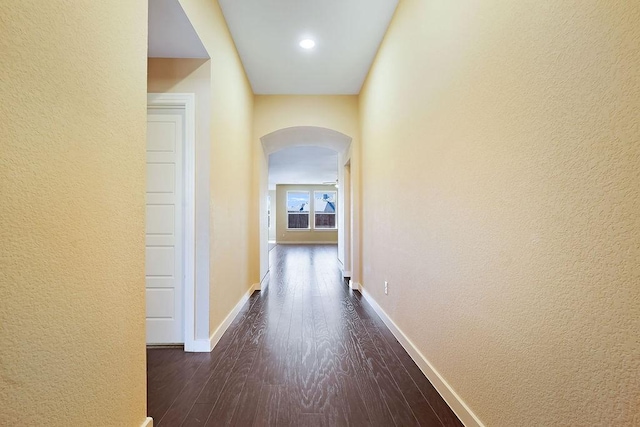 corridor featuring dark hardwood / wood-style floors