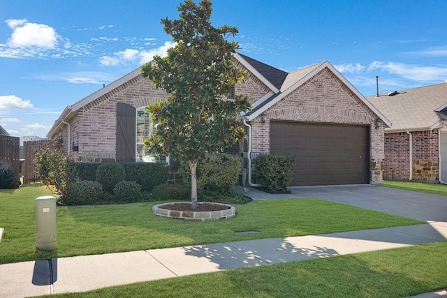 view of front of property featuring a garage and a front yard